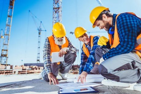 Construction professionals reviewing plans